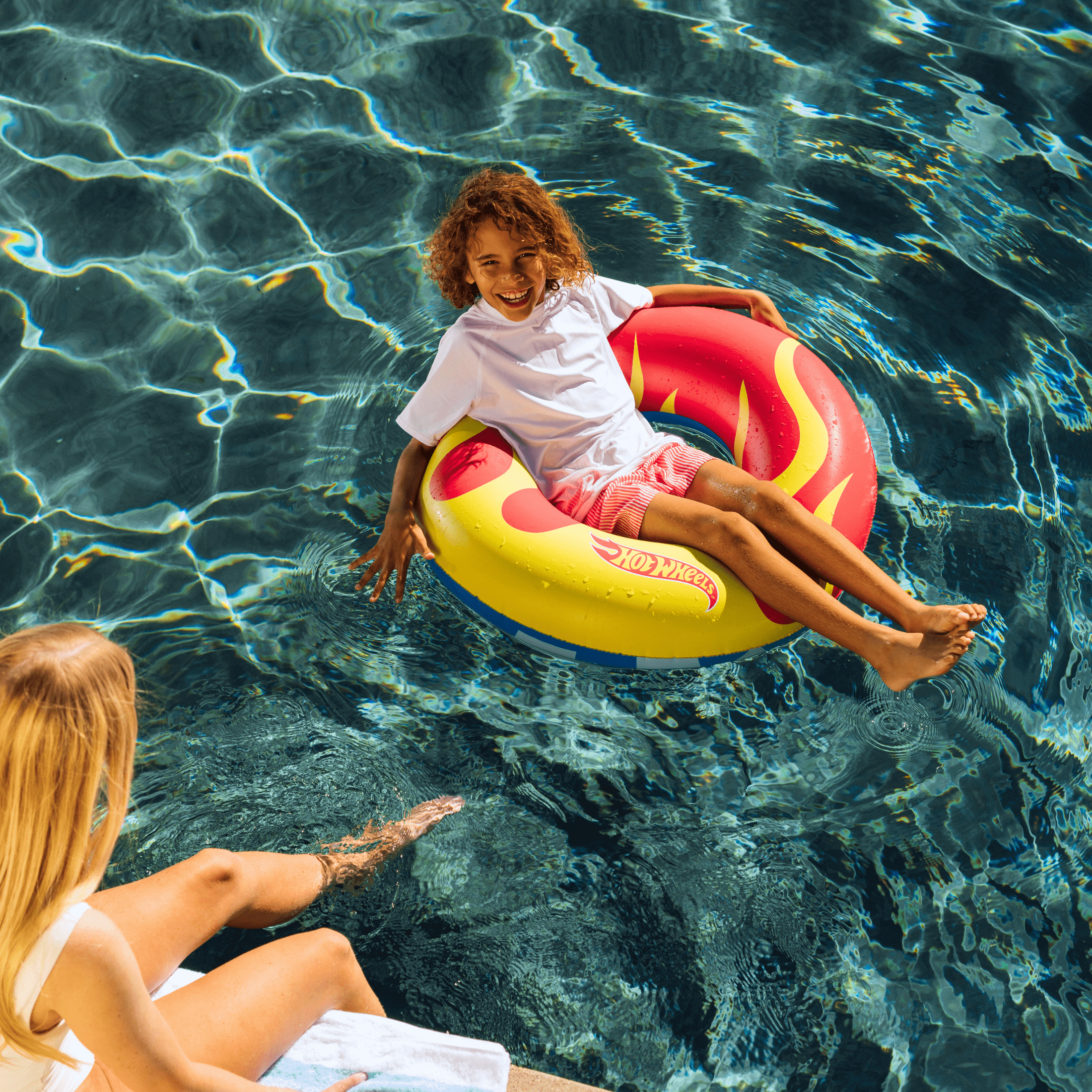 Hot Wheels™ by FUNBOY Double-Sided Checked and Flame Inflatable Tube, 34’’